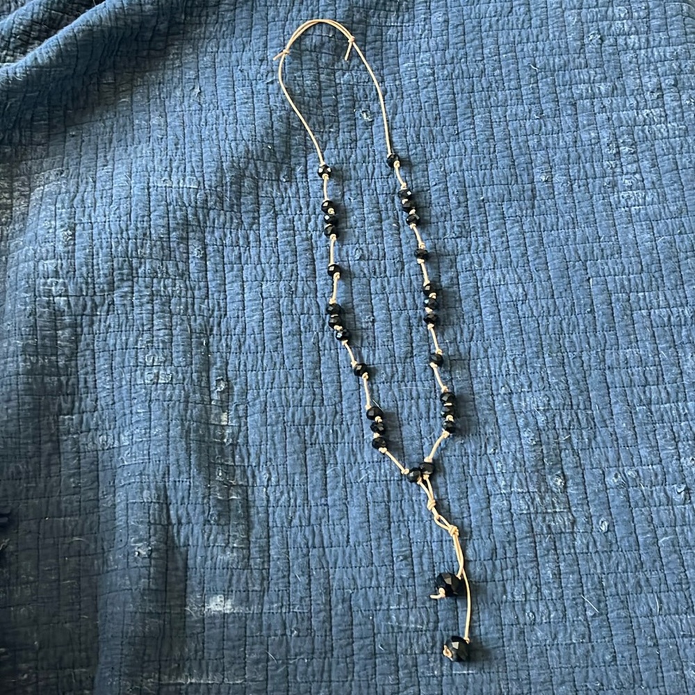 Black Bead Necklace on gold/tan knotted string
